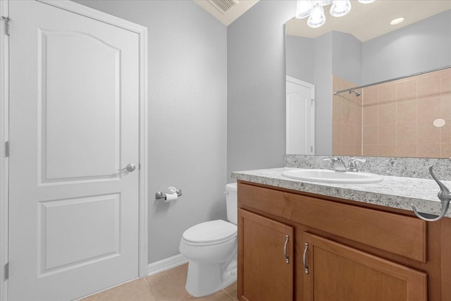 bathroom with vanity, walk in shower, tile patterned floors, and toilet