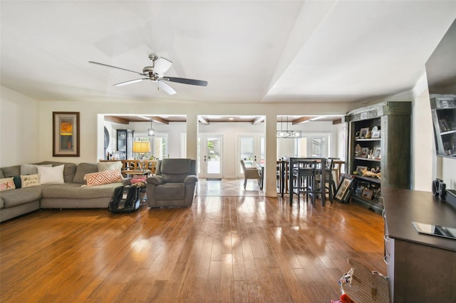 living room with ceiling fan and hardwood / wood-style floors