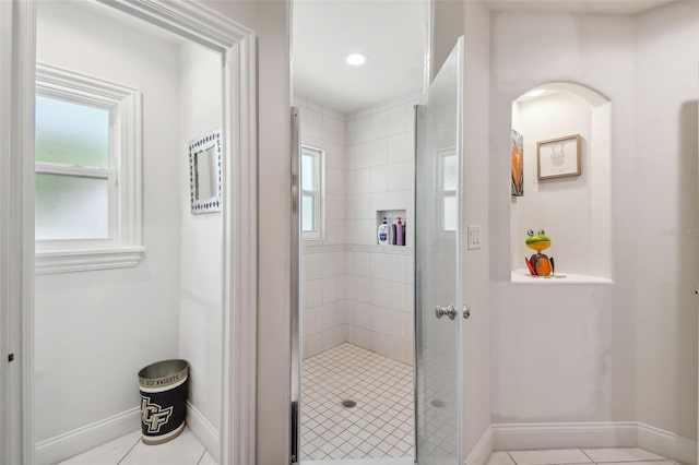 bathroom featuring tile patterned floors and an enclosed shower