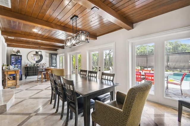 dining room with wooden ceiling, beam ceiling, and french doors