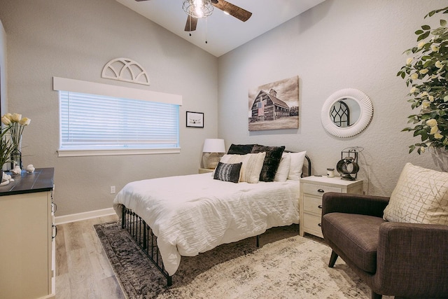 bedroom featuring vaulted ceiling, ceiling fan, and light hardwood / wood-style floors