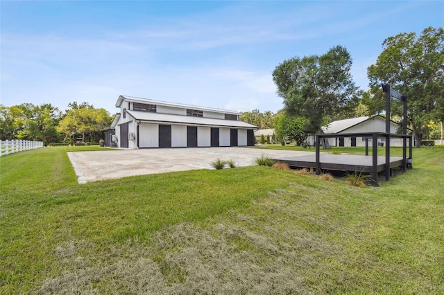 exterior space with a yard and a garage