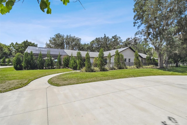 view of side of home featuring a yard