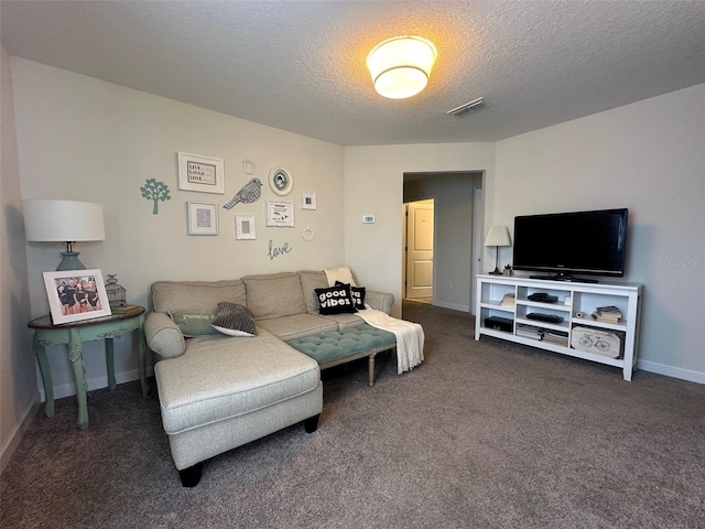 carpeted living room with a textured ceiling