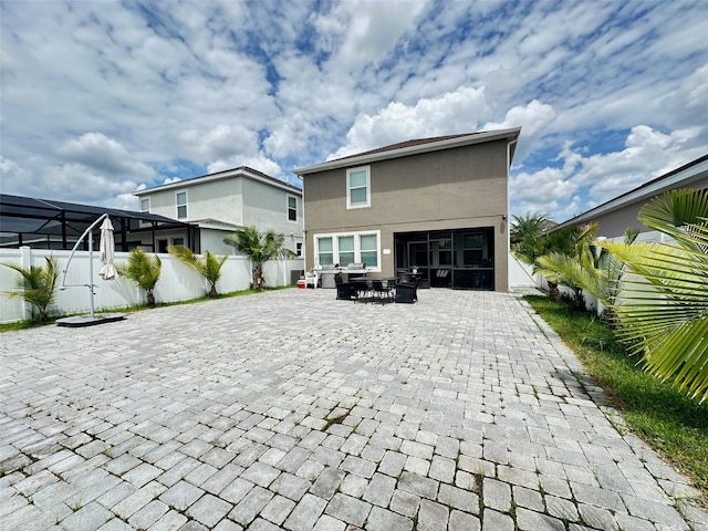 rear view of property with a patio area