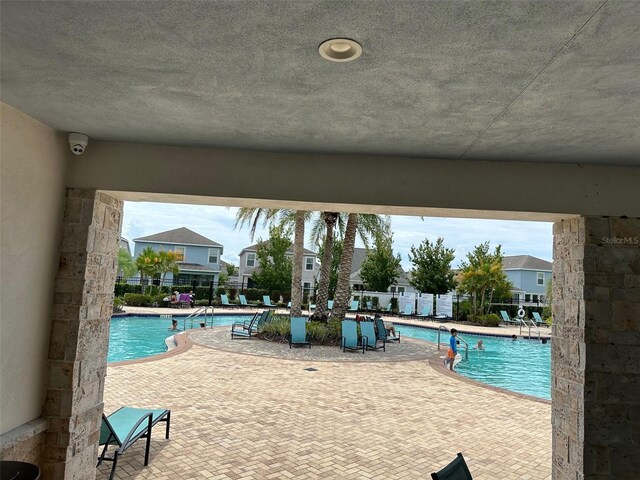 view of swimming pool with a patio area