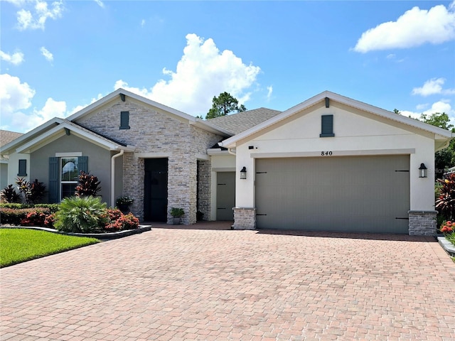 view of front of property with a garage