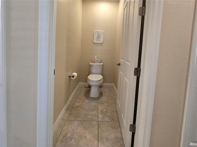 bathroom featuring tile patterned floors and toilet