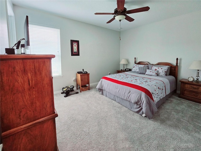 bedroom with ceiling fan and carpet