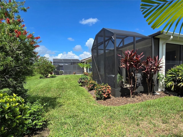 view of yard with a lanai