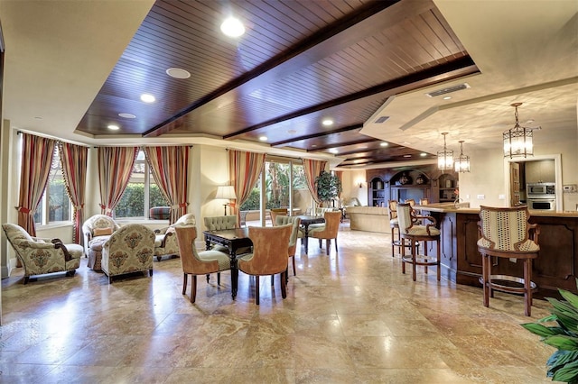 dining area featuring an inviting chandelier, a raised ceiling, and wooden ceiling