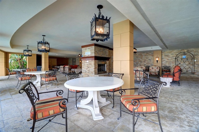 view of patio / terrace featuring a multi sided fireplace