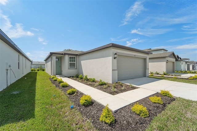 view of front of house featuring a garage and a front lawn