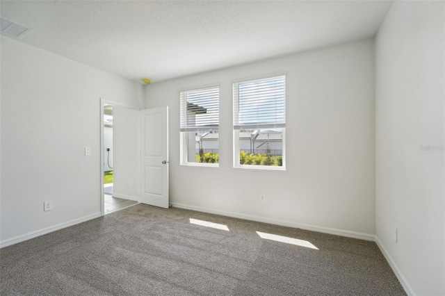 spare room featuring carpet floors