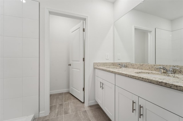 bathroom with tile patterned flooring and vanity