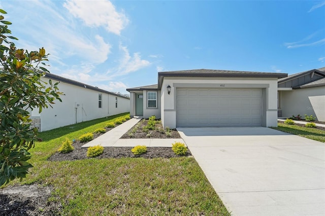 view of front facade with a front lawn and a garage