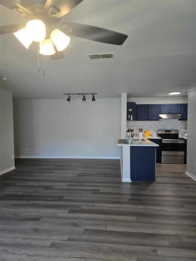 kitchen with sink, blue cabinets, stainless steel electric range, and dark wood-type flooring