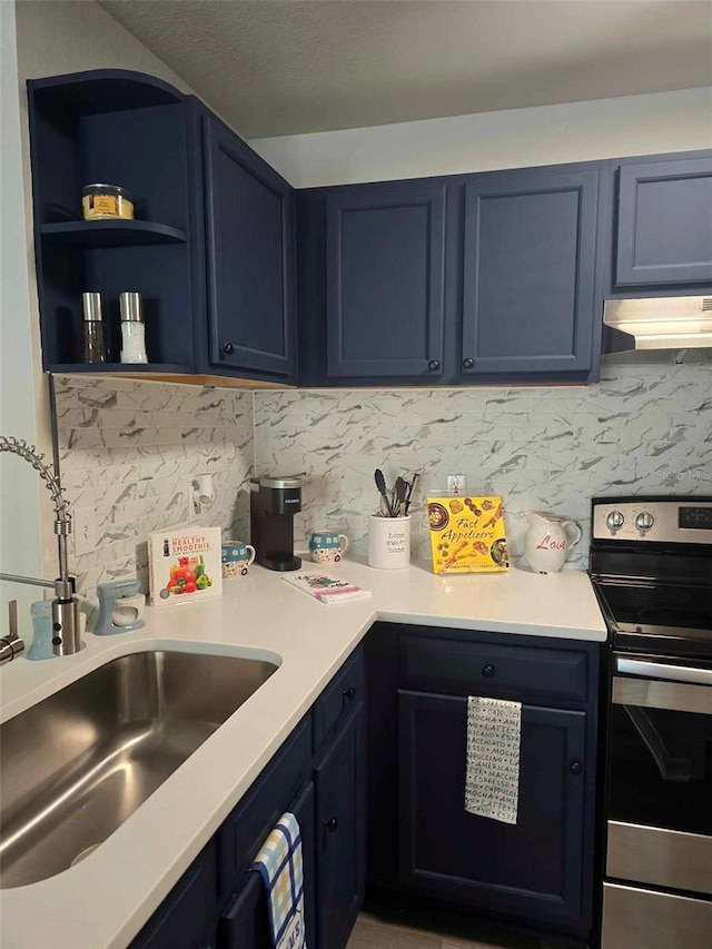 kitchen with sink, backsplash, blue cabinets, and stainless steel range with electric cooktop