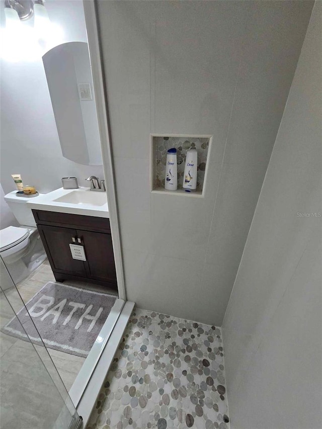 bathroom with toilet and vanity