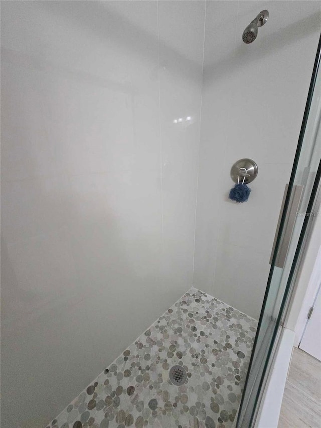 bathroom with a tile shower