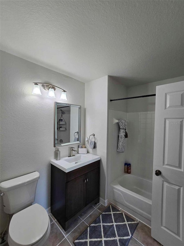 full bathroom with washtub / shower combination, tile patterned floors, vanity, and toilet