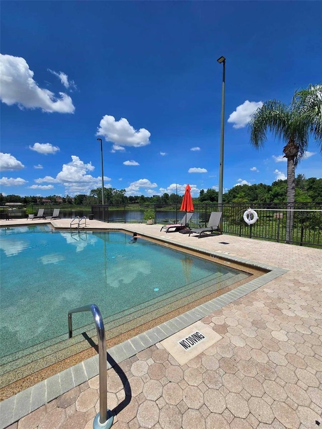 view of swimming pool featuring a patio area