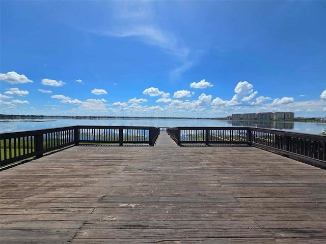 wooden terrace featuring a water view