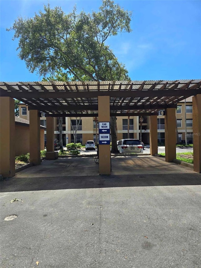 view of parking with a carport