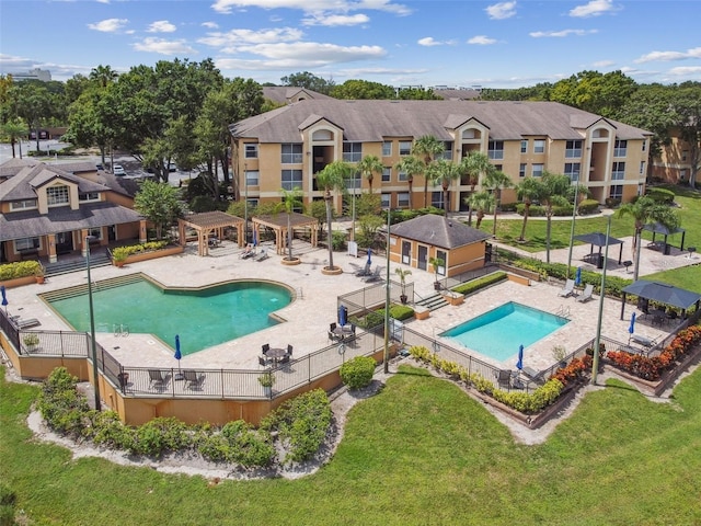 view of pool featuring a patio area, a pergola, and a yard