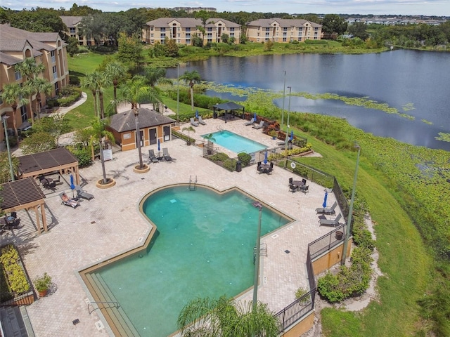 view of pool with a patio area, a gazebo, and a water view