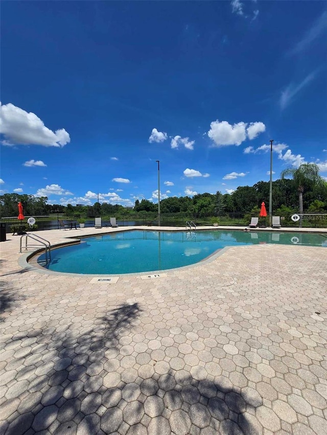 view of pool featuring a patio