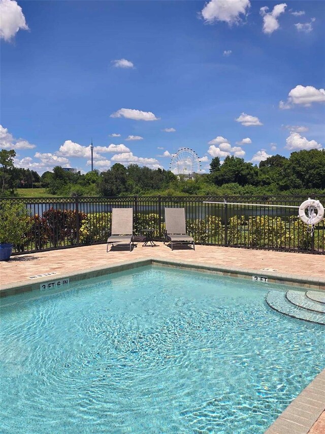 view of swimming pool with a patio area