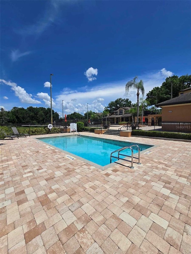 view of swimming pool featuring a patio