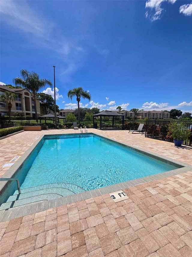 view of pool featuring a patio area and a gazebo