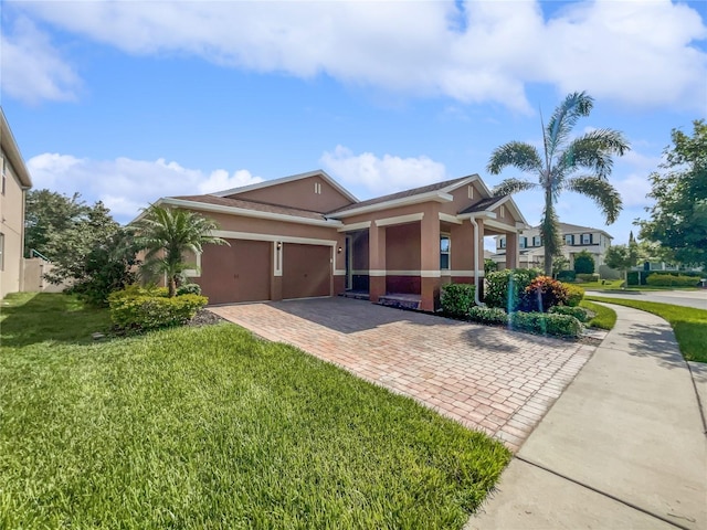 view of front of home featuring a garage and a front yard