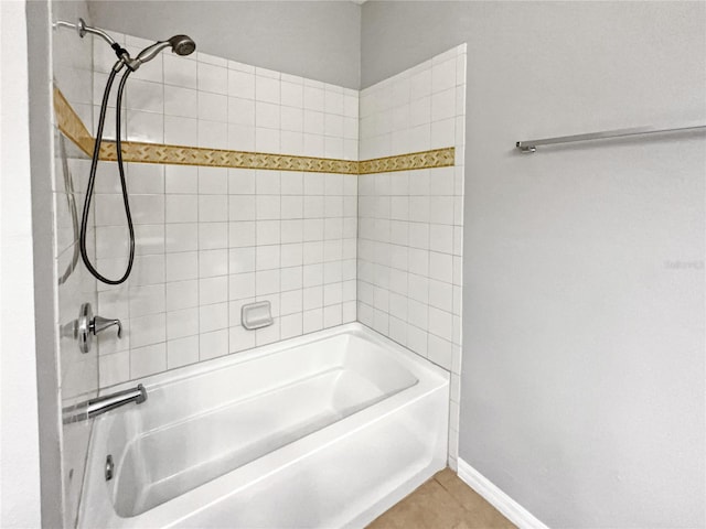 bathroom with tile patterned flooring and tiled shower / bath combo