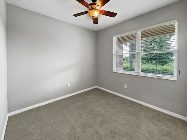 carpeted empty room featuring ceiling fan