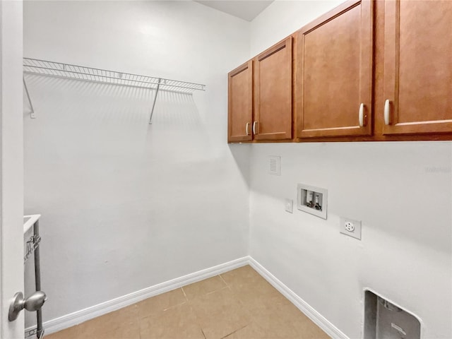 laundry area with electric dryer hookup, light tile patterned floors, hookup for a washing machine, and cabinets