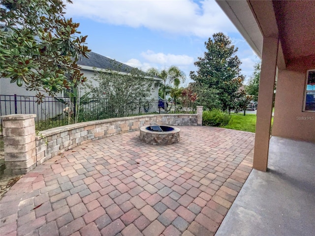 view of patio with an outdoor fire pit