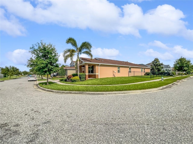 view of property exterior featuring a lawn