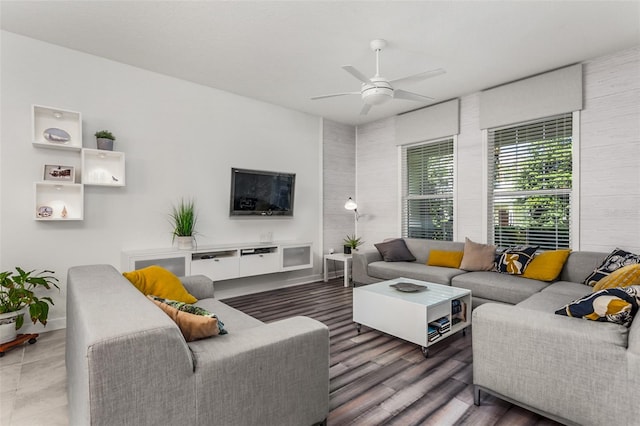 living room with dark hardwood / wood-style floors and ceiling fan