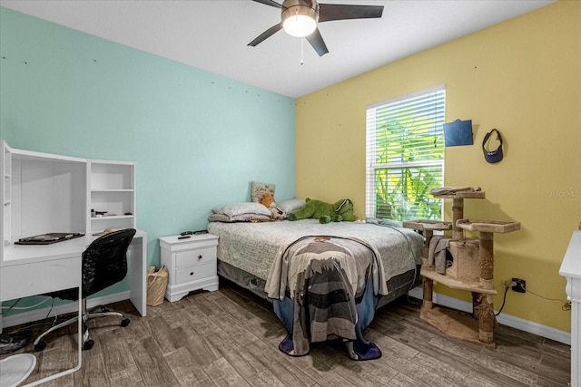 bedroom with ceiling fan and hardwood / wood-style floors