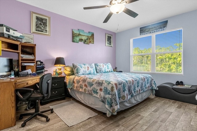 bedroom featuring ceiling fan and hardwood / wood-style flooring