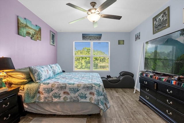 bedroom featuring ceiling fan and hardwood / wood-style floors