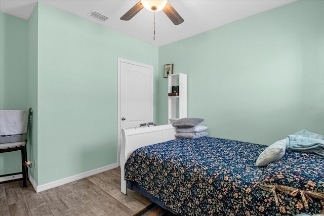 bedroom featuring ceiling fan and wood-type flooring