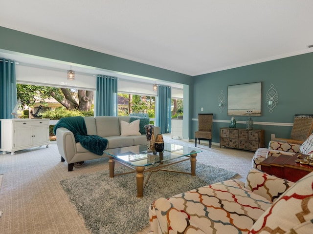 living area featuring carpet floors, crown molding, and baseboards