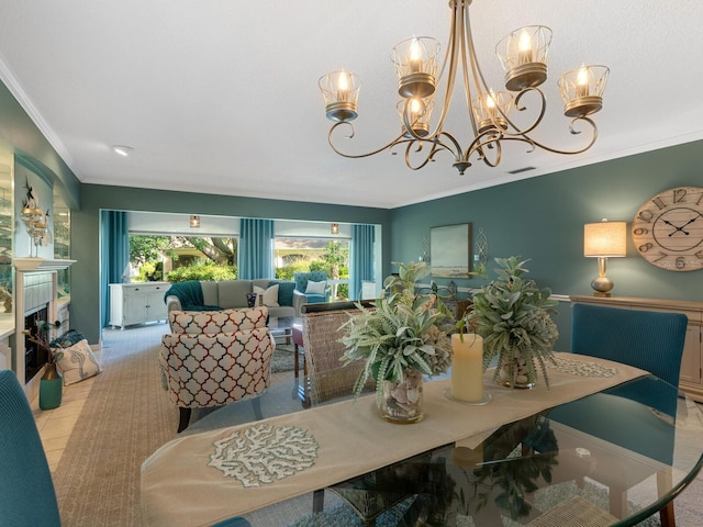 dining space with light tile patterned flooring, an inviting chandelier, and ornamental molding