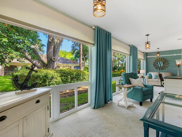 sunroom with visible vents and a wealth of natural light