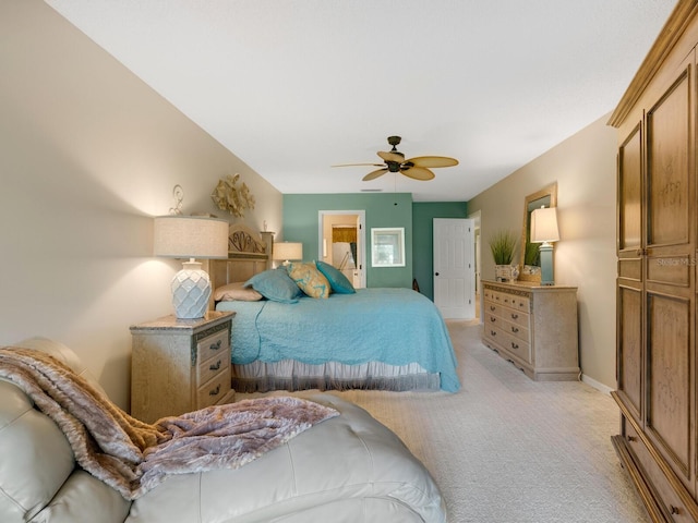 bedroom featuring baseboards, a ceiling fan, and light colored carpet