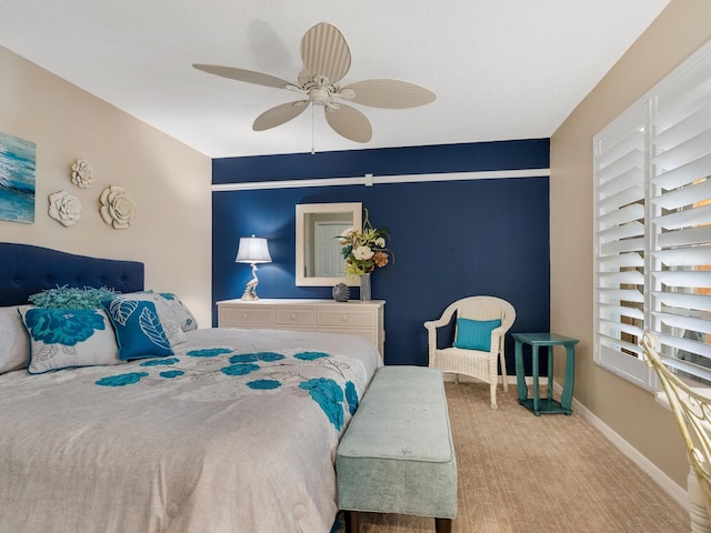 bedroom featuring carpet floors, ceiling fan, and baseboards